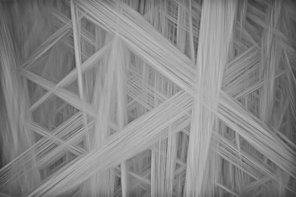 Close-up of geometric patterns showing parallel lines, cross-hatching and grid designs.