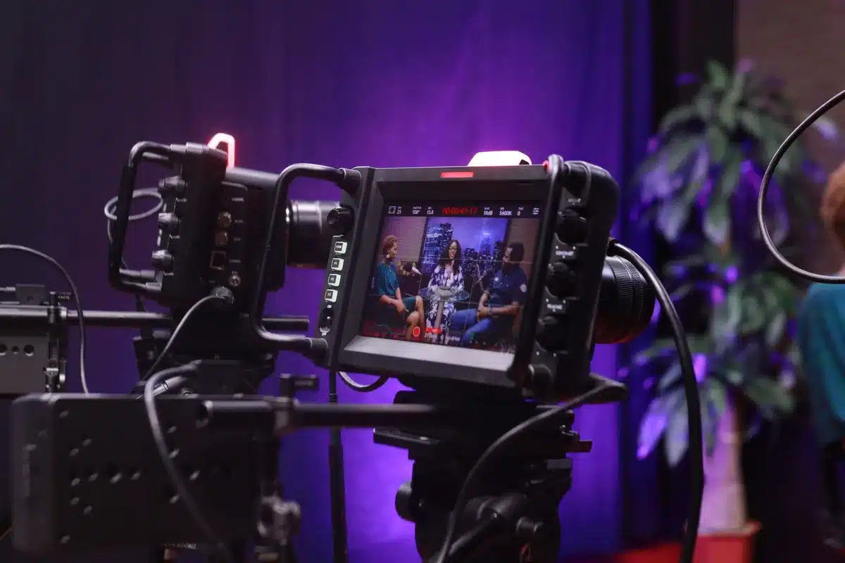 Television studio setting with interview setup and broadcasting equipment