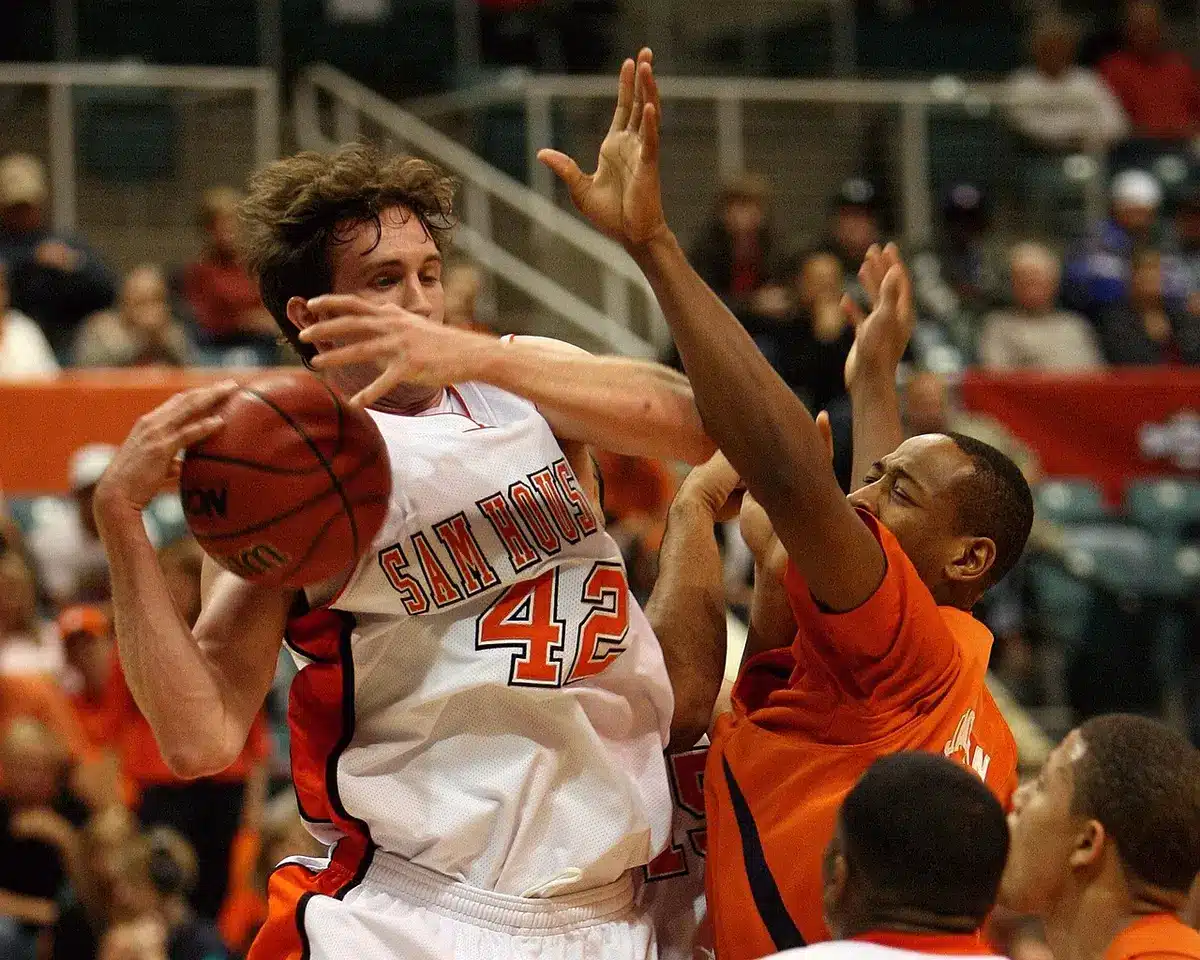 Basketball player in defensive position during game