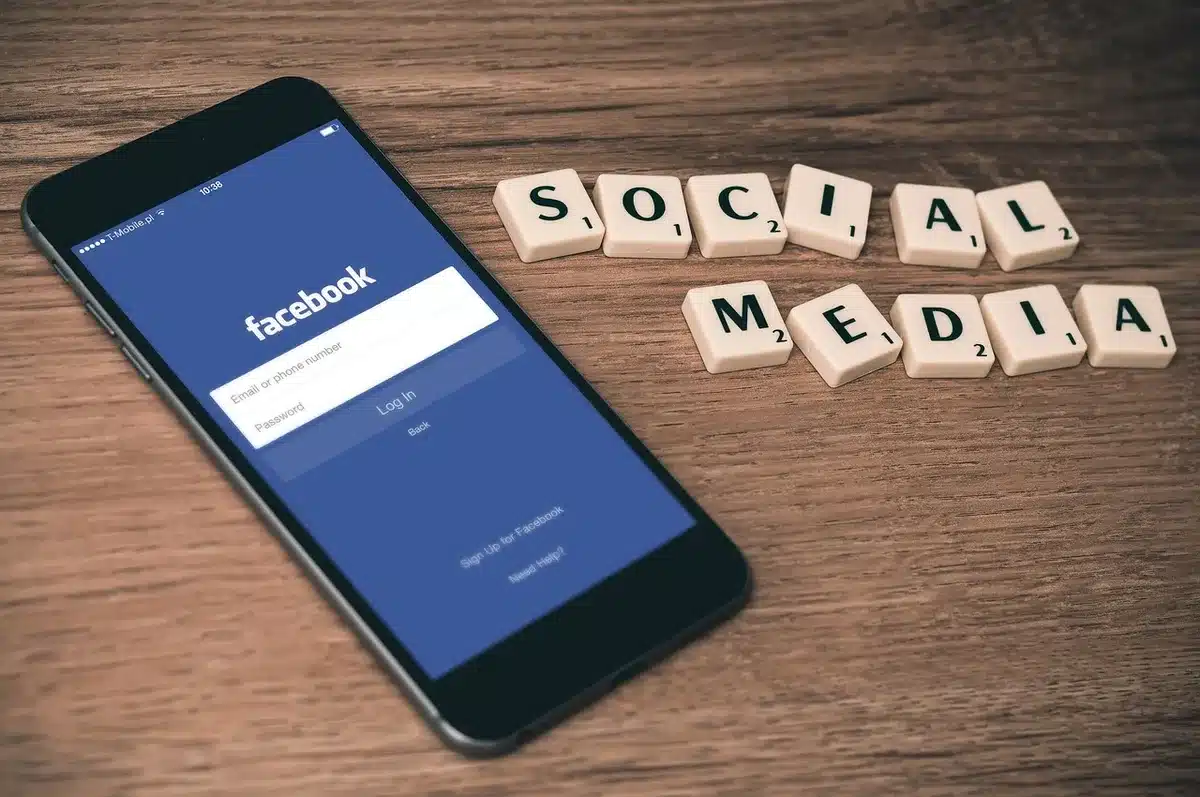 Phone screen showing inflammatory social media posts and angry comments