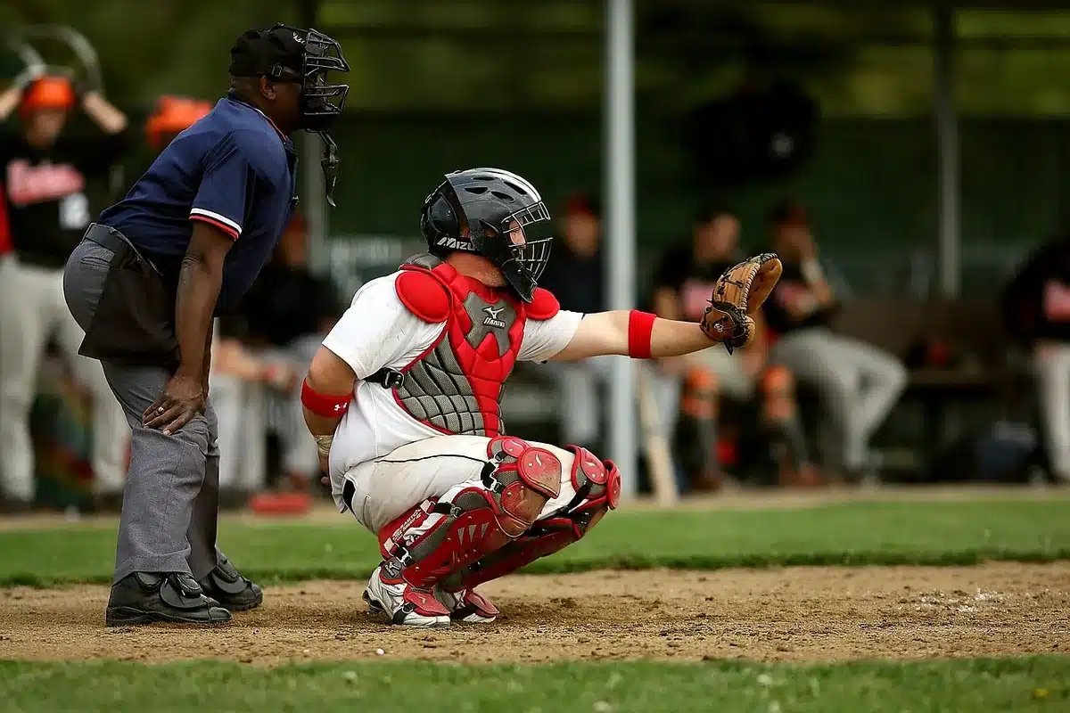 Baseball player executing a powerful swing at the plate during a game
