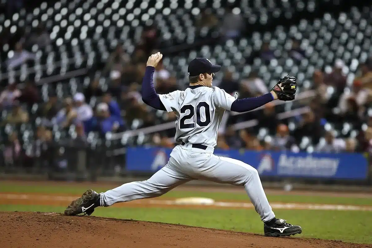 Baseball pitcher mid-throw during a game