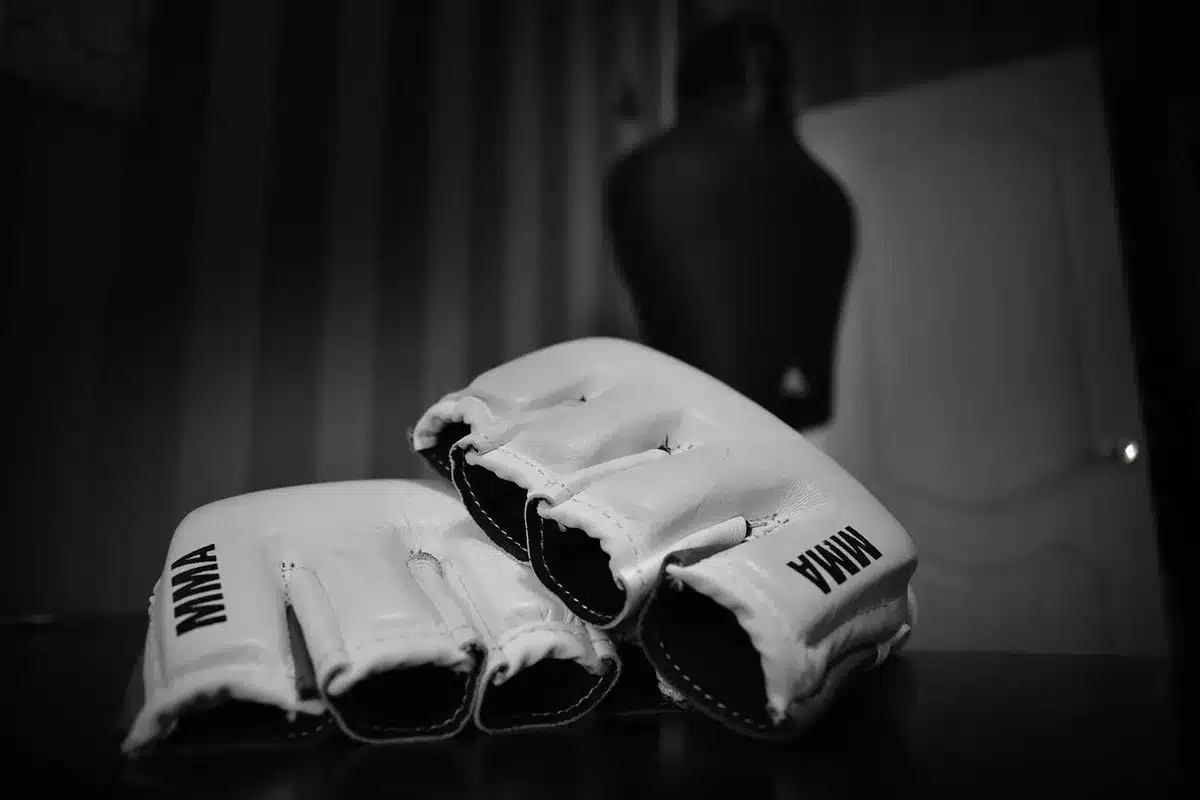 Two fighters in intense confrontation before rematch bout