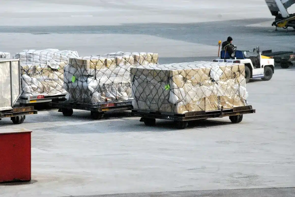Stacked cardboard boxes and packaging materials in a warehouse or production facility