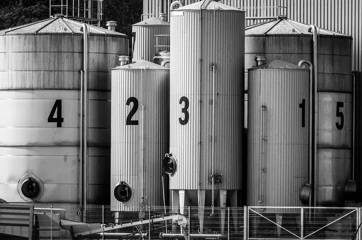 Industrial production line processing wood waste into lightweight foam panels for packaging applications