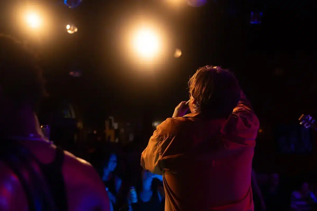 Performer on stage delivering a dynamic musical performance