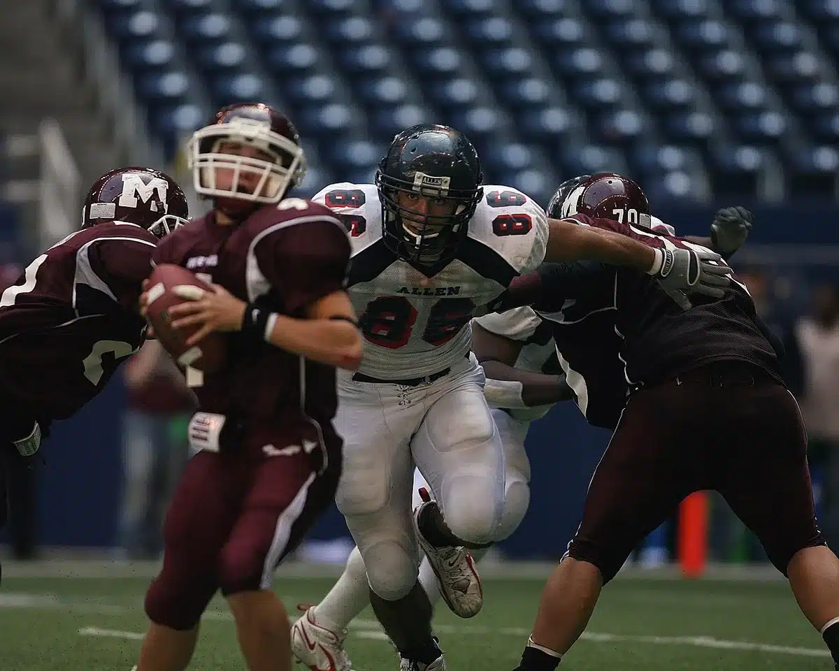 Brock Purdy releasing a pass in-game (anonymous quarterback depiction)