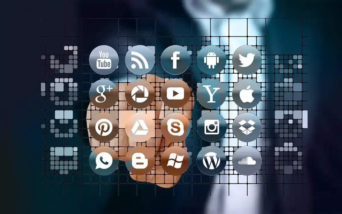 Researchers analysing social media data on laptop screens