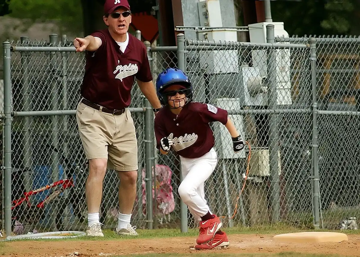 Ground ball and first baseman missing a throw during a close play
