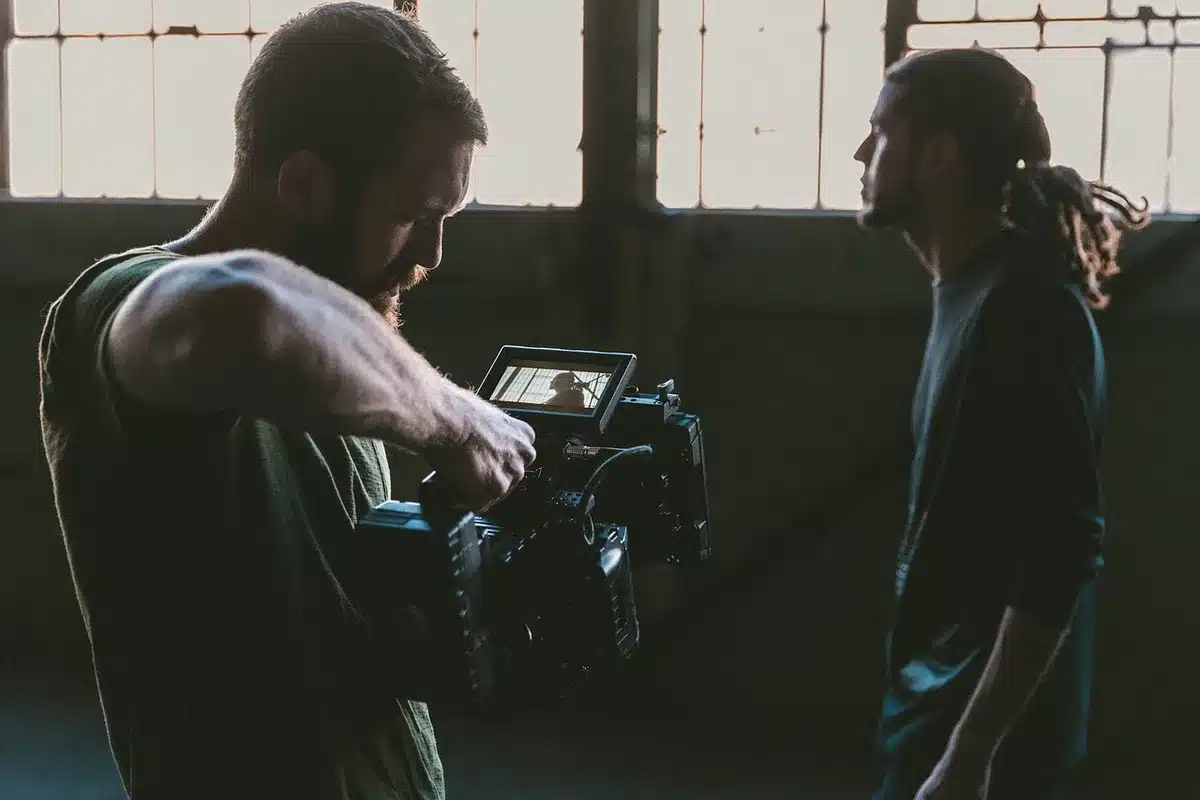 Clapperboard and camera gear on a production set, representing reboot filming plans