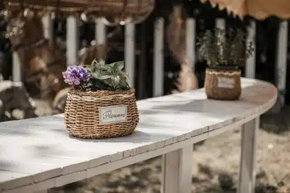 Baskets of mixed heirloom apples on a wooden market table