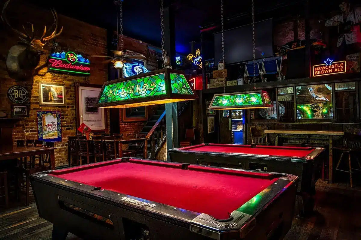 Empty pub with tables and an alcohol-free area sign
