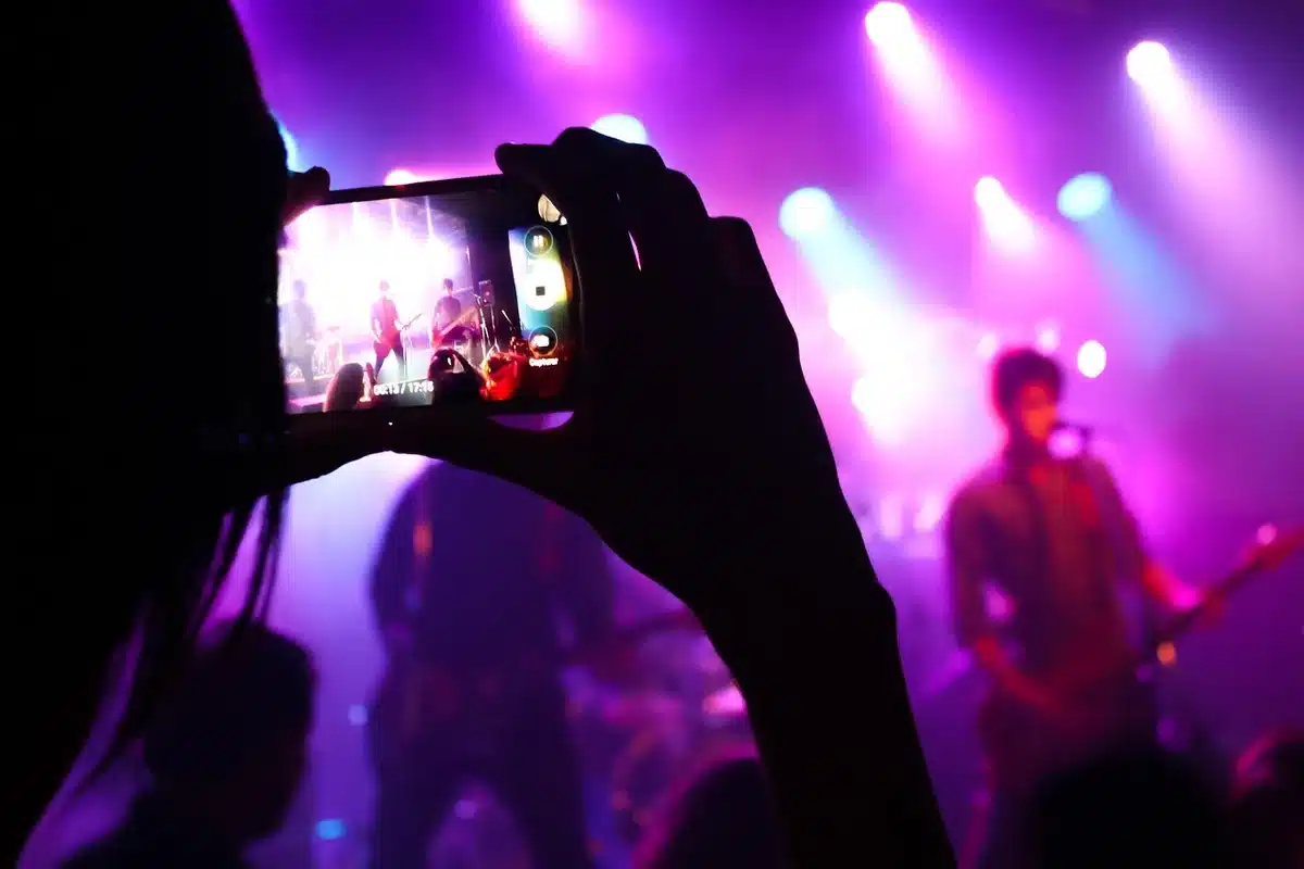 Silhouettes on a theatrical stage with dramatic set pieces