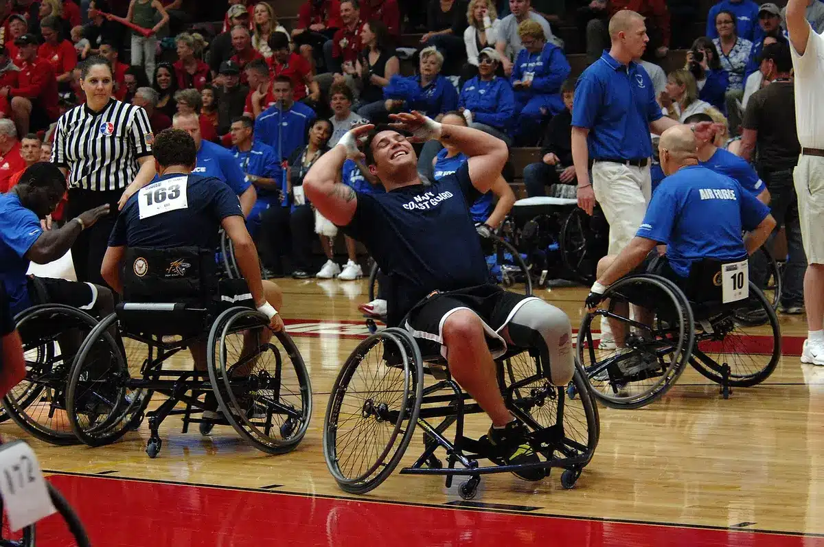 Multiple star players celebrating on the court after a scoring play