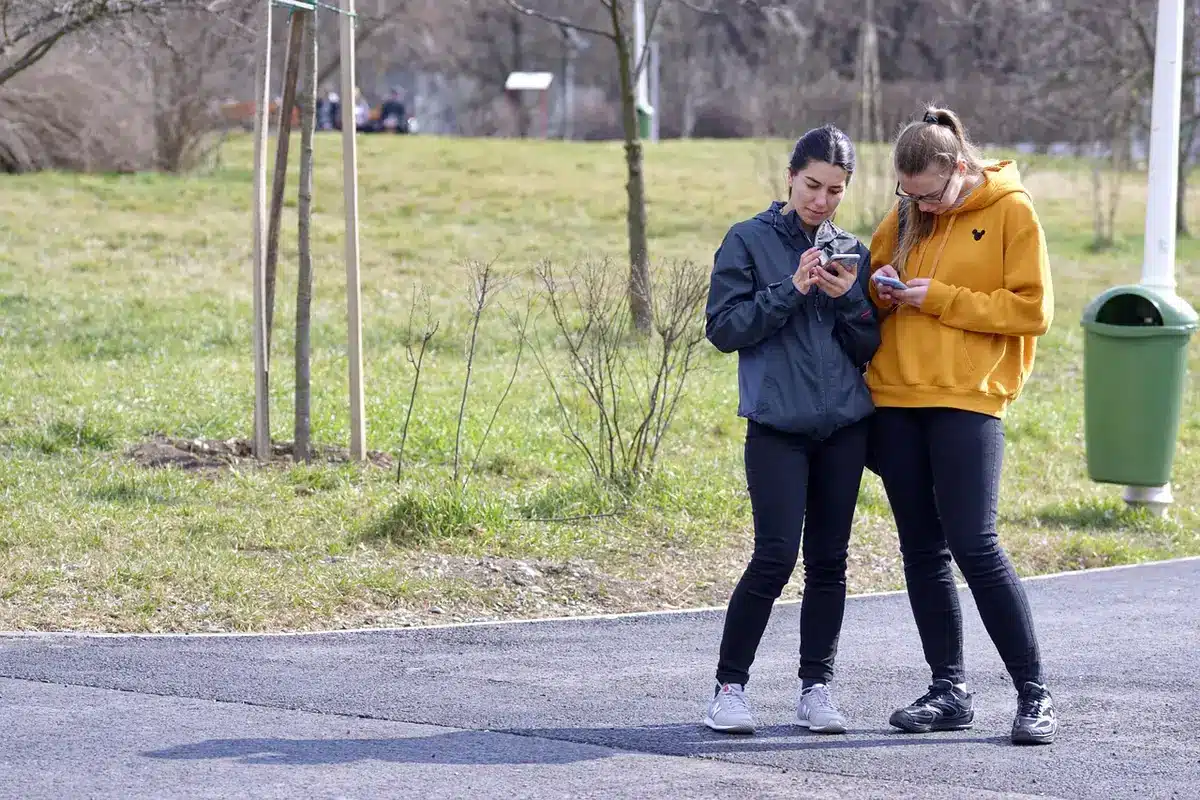 People recording and scrolling TikTok clips on smartphones