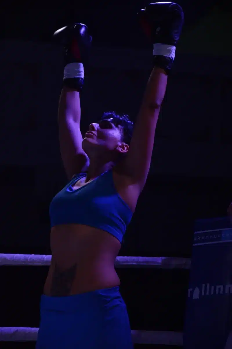 Two fighters exchanging heavy strikes in the cage, illustrating stylistic contrast